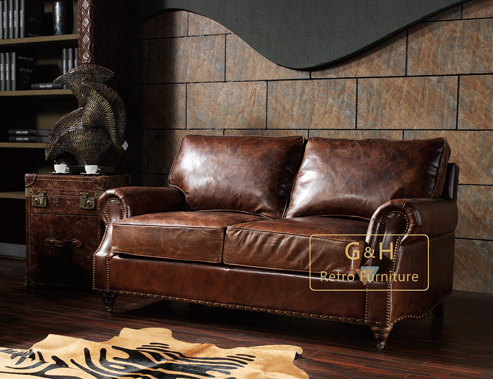 Distressed tan leather sofa