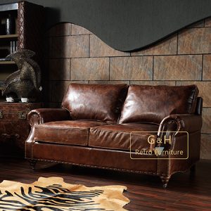 Distressed tan leather sofa